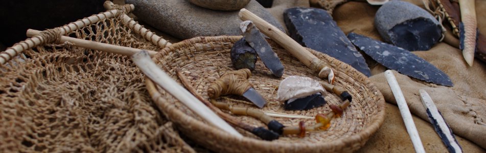 replica's of stone age finds from stone, bone, antler, plant fibers
